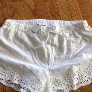 New! White woven shorts w/ floral design on edges!